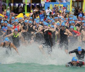Men-swim-start-and-running-towards-water